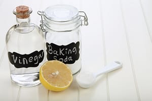baking soda vinegar and lemon on the white table